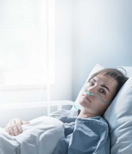 Patient waiting for discharge | Hospital Performance Improvement | Post-Acute Care Management | Quality of Patient Care | Timely patient discharge | Patient Care Management Solutions | Hospital Operational Efficiency | Healthcare Consulting | Comprehensive care management | Hospital discharge planning | Strategic healthcare consulting | Innovative healthcare solutions | Doctor Woman Consultation | Innovative healthcare strategies | Hospital system savings | Value-based care | Collaborative patient care | Operational healthcare consulting